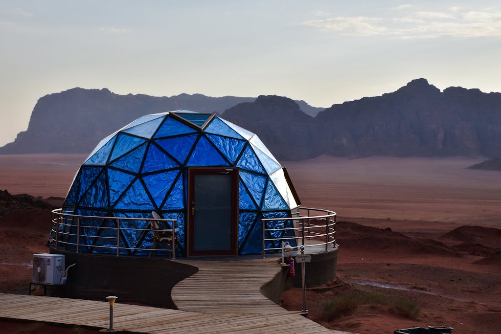Explore the futuristic geodesic dome amidst the stunning landscape of Wadi Rum, Jordan.