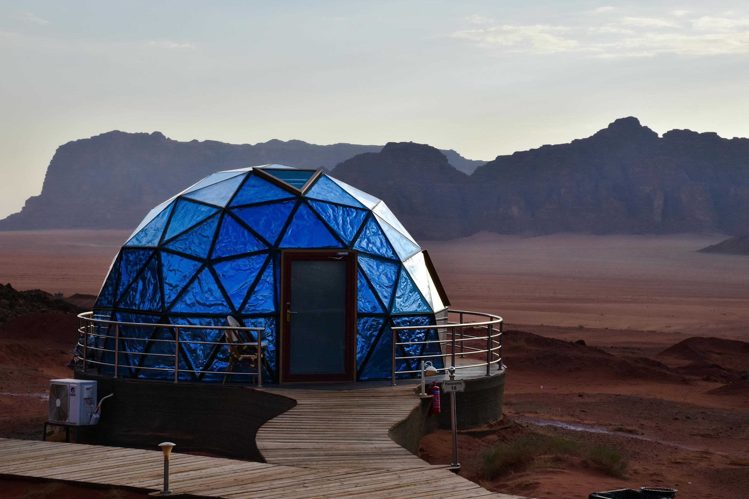 Explore the futuristic geodesic dome amidst the stunning landscape of Wadi Rum, Jordan.