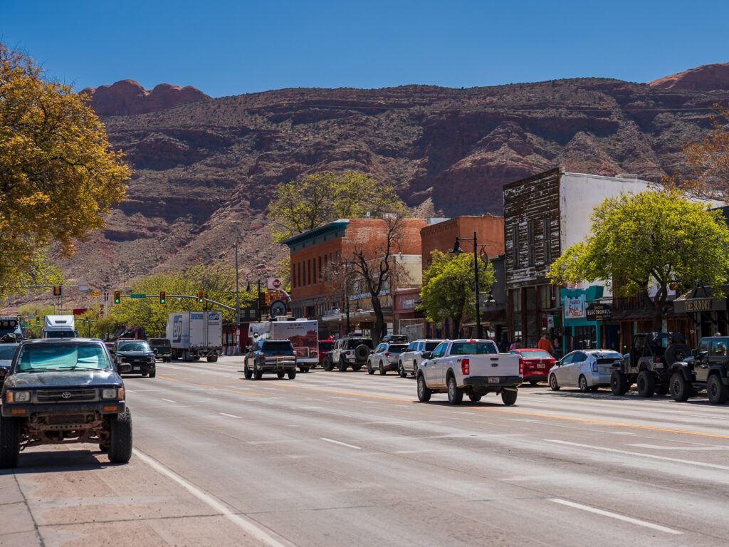 Highway 191 at the center of Moab Utah showing low traffic in early fall the best time to visit moab.