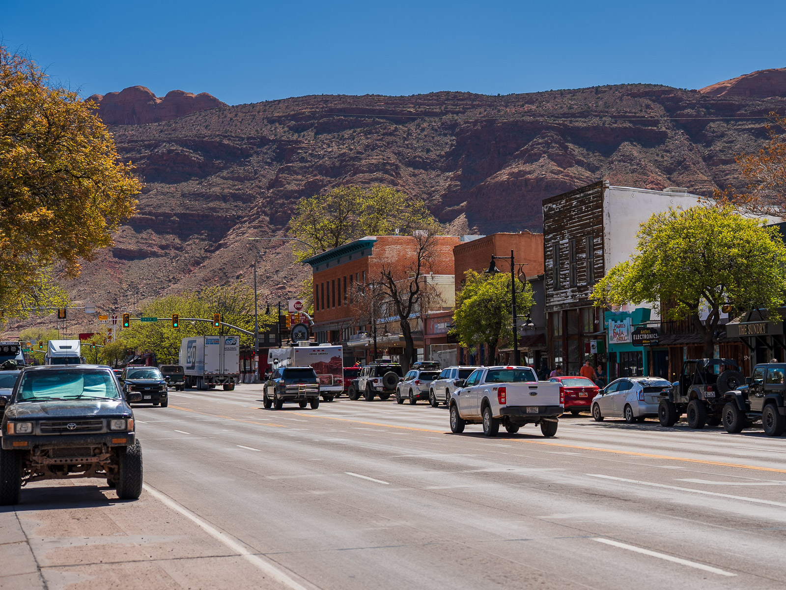 Highway 191 at the center of Moab Utah showing low traffic in early fall the best time to visit moab.