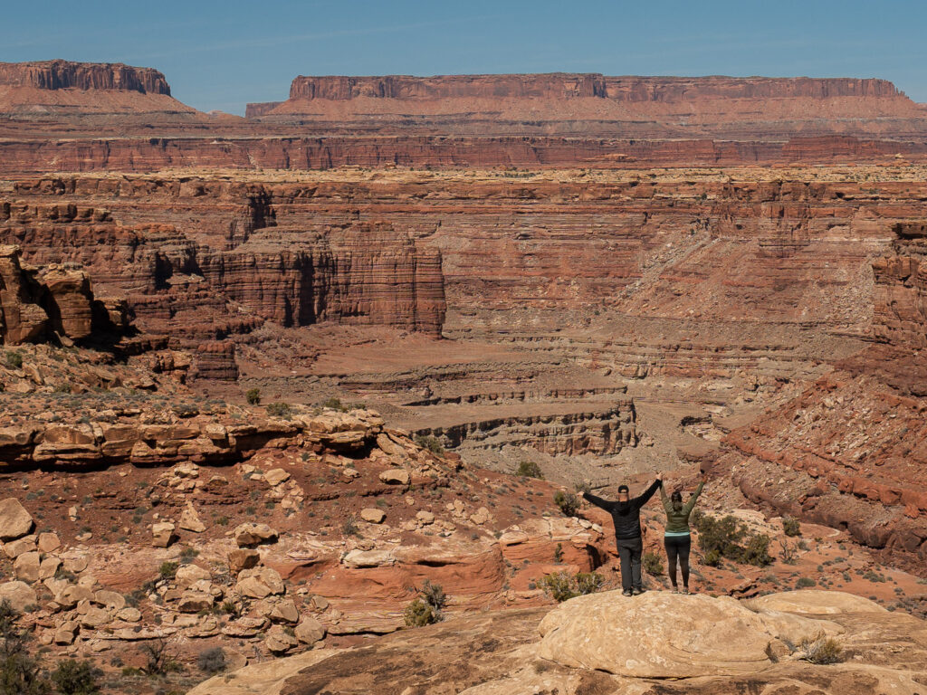 Rocio and gabe in a canyon in the Needles District in Canyonlands National Park