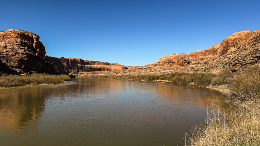 The Colorado River surrounded by red buttes