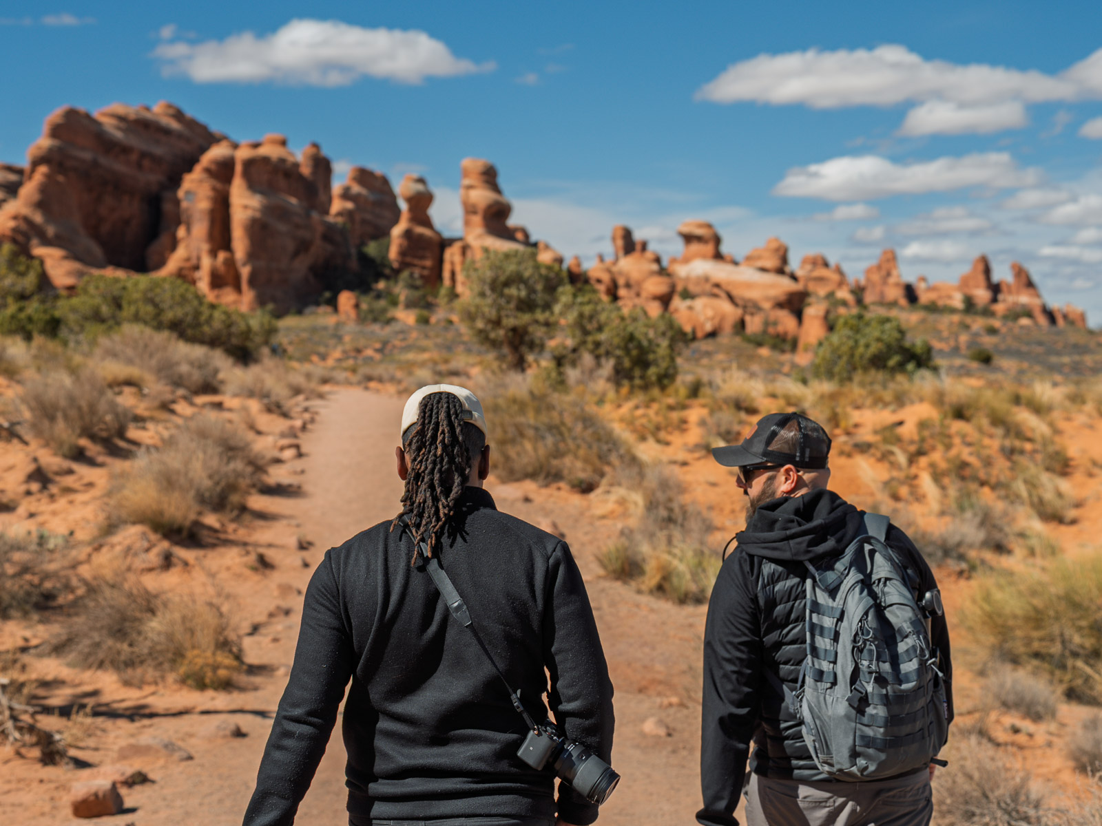 gabe and Randdy hiking Landscape Arch trail in Arches National Park in Moab Utah